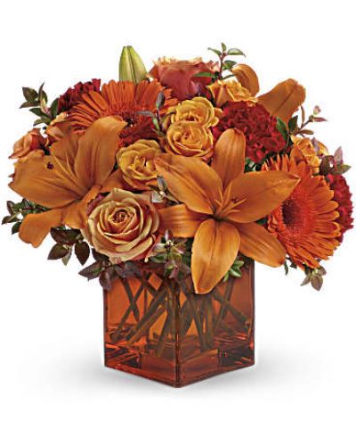 <div id="mark-3" class="m-pdp-tabs-marketing-description">Celebrate the wonder of a new day with warm, golden flowers. A modern orange glass vase is the foundation of this stunning, sun-bright bouquet that energizes any occasion.</div>
<del> </del>
<ul>
<li>Orange gerbera daisies, orange roses and red mini carnations are accented with a spray of red huckleberry in an orange cube</li>
</ul>
<div id="desc-3">
<ul>
<li>vase.</li>
</ul>
</div>
<ul>
<li></li>
</ul>
