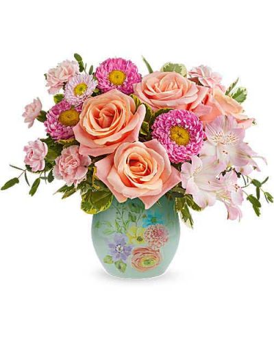 Teleflora's Watercolor Garden Bouquet is a cheerful Mother's Day flower arrangement of peach and pink blooms, beautifully presented in Teleflora's Watercolor Garden Vase keepsake-perfect for celebrating Mom with fresh spring style.
Teleflora's Watercolor Garden Bouquet features peach roses, pink alstroemeria, miniature pink carnations, and pink Matsumoto asters, accented with parvifolia eucalyptus and variegated pittosporum, delivered in Teleflora's Watercolor Garden Vase.
